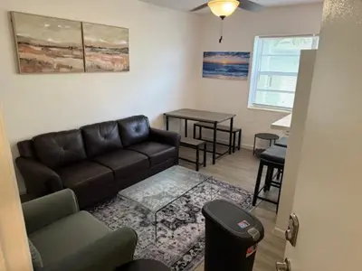 a living room with a couch and a table at 9064 Collins Ave 2 in Miami Beach