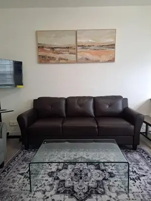 a living room with a couch and a coffee table at 9064 Collins Ave 2 in Miami Beach