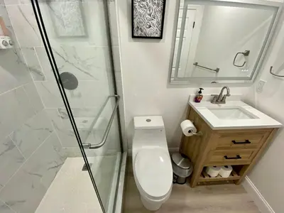 a bathroom with a shower and a toilet and a sink at Hollywood Escape in Hollywood