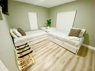 a room with two white chairs and two windows at Hollywood Escape in Hollywood