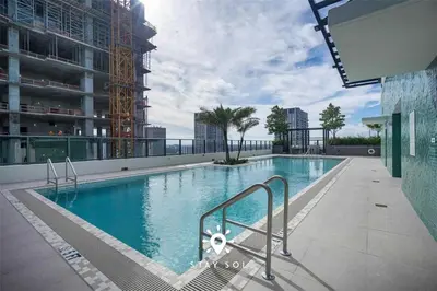 a large swimming pool on top of a building at Sophisticated Studio with Pools in Miami