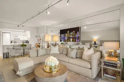 a living room with a couch and a table at Seaside Condo - Studio for 4 in Miami Beach