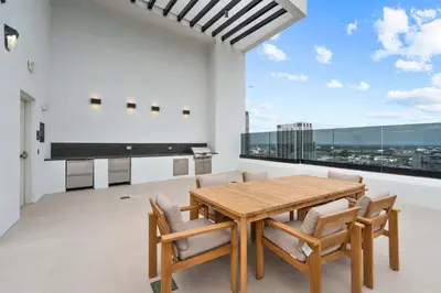 a dining room with a table and chairs and a large window at Central Downtown Miami at District 225 Luxury Residence in Miami