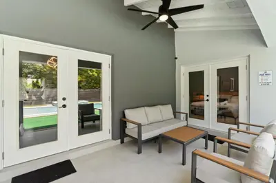 a living room with a couch and a chair at Heated Pool Games Family Haven Near FIU