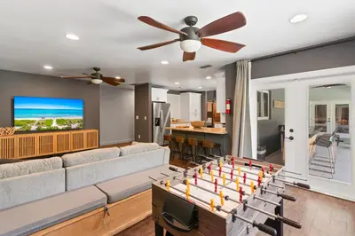 a living room with a couch and a table at Heated Pool Games Family Haven Near FIU
