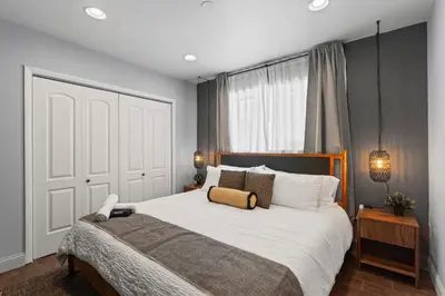 a bedroom with a large bed and a window at Heated Pool Games Family Haven Near FIU