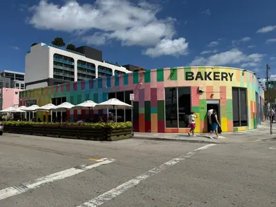 a brightly colored building on the side of a street at Kayoma Hostel in Miami