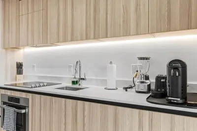 a kitchen counter with a sink and a blender at Hotel-Style Condo at District 225 in Downtown Miami in Miami