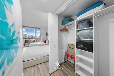 a small room with a bed and a bedroom at Cozy studio near beach Nice views in Hallandale Beach