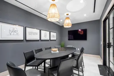 a dining room with a black table and chairs at Luxury Condo at District 225 - Downtown Miami Prime Location in Miami