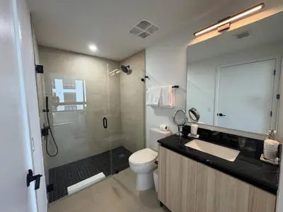 a bathroom with a toilet and a sink and a shower at Luxury Condo at District 225 - Downtown Miami Prime Location in Miami