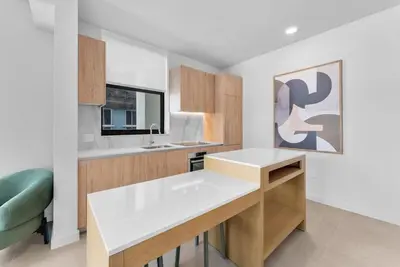 a kitchen with a white counter top in a room at Chic Downtown Miami 2BR City Views Rooftop Pool in Miami