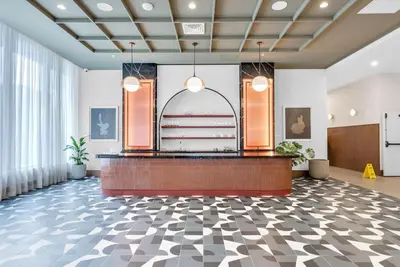 a lobby with a reception desk in a building at Chic Downtown Miami 2BR City Views Rooftop Pool in Miami