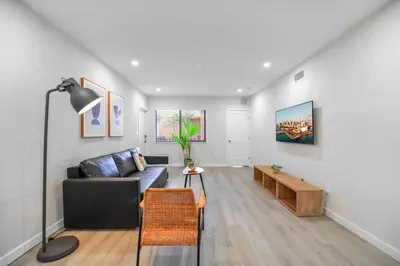 a living room with a couch and a table at Modern Apartment in Prime Miami Location in Miami