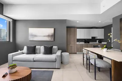 a living room with a couch and a table at Brickell Condos by Vibras Concierge in Miami
