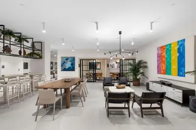 a dining room and living room with a table and chairs at Prime Location Condo at District 225 Downtown in Miami