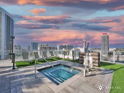 a rooftop hot tub on the roof of a building at Cozy Apartment -Balcony & Beachfront Resort in Hollywood