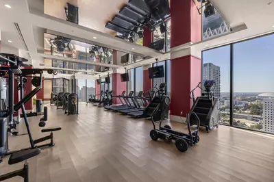 a gym with treadmills and exercise equipment in a building at Stylish Condo at The Crosby in Miami