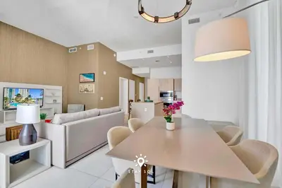 a living room with a table and a couch at Beautiful Balcony 2BR Resort in Hollywood
