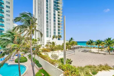 a view of a resort with a pool and a beach at Beautiful Balcony 2BR Resort in Hollywood