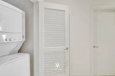 a kitchen with a white refrigerator and a microwave at Beautiful Balcony 2BR Resort in Hollywood