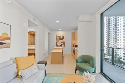 a living room with a couch and a table at Elegant Condo at Crosby Miami Worldcenter W Rooftop Pool & Fitness Center in Miami