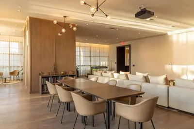 a dining room with a couch and a table and chairs at 2909 Elegant 1BR in Miami Downtown with Pool and Gym in Miami