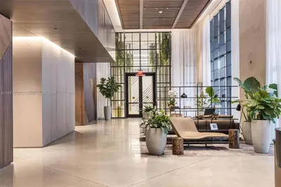 a lobby with potted plants in a building at 4905 Corner Penthouse with Sunset Views a Pool and Gym in Downtown Miami in Miami