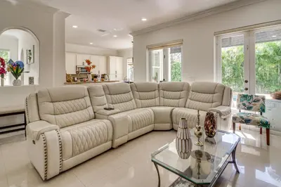 a living room with a couch and a table at Great for Gatherings! Sleek and Relaxing Hialeah Gem in Hialeah