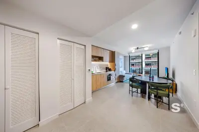 a kitchen and dining room with a table and chairs at Spacious & Elegant 1BD Apt in Miami in Miami