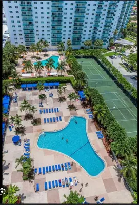 an aerial view of a resort with a tennis court at Beautiful Apartment in Sunny Isles Beach in Sunny Isles Beach