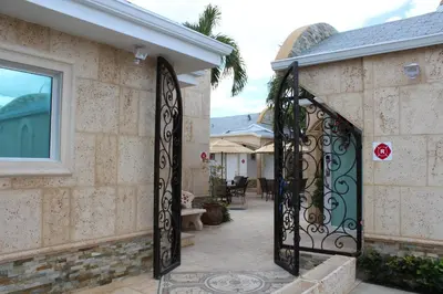 an entrance to a house with an iron gate at Casa Pellegrino Boutique Hotel in Hollywood