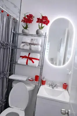 a bathroom with a toilet and a sink and a mirror at Villa Clara EPIC-Little Havana in Miami
