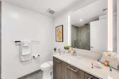 a white bathroom with a sink and a toilet at Bay Views Studio in Miami
