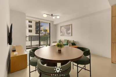 a dining room with a table and chairs at High Rise Haven with Pool Cowork & Spa in Miami in Miami