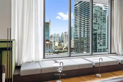 a window seat with a view of a city at High Rise Haven with Pool Cowork & Spa in Miami in Miami