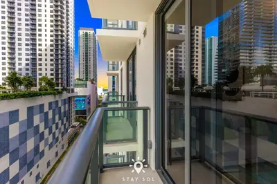 a balcony in a building with views of a city at High Rise Haven with Pool Cowork & Spa in Miami in Miami