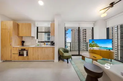 a kitchen with a table and a tv in a room at Luxurious & Stylish 2BD Apt in Miami Gym & Pool in Miami