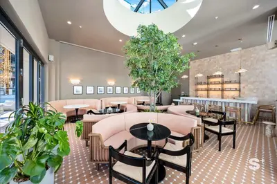 a restaurant with tables and chairs and plants at Luxurious & Stylish 2BD Apt in Miami Gym & Pool in Miami