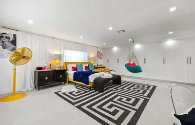 a bedroom with a bed and a rug at Delano in Fort Lauderdale