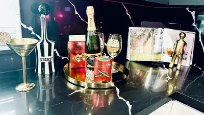 a table with a bottle of wine and a glass at Delano in Fort Lauderdale