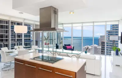 a large kitchen with a view of the ocean at MVR - Luxury Stay by Brickell Center in Miami