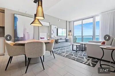 a living room with a table and chairs and a dining room at Hyde house 3507 AL MAR in Hollywood