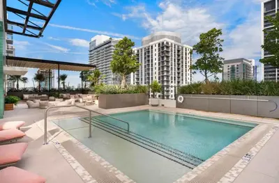 a swimming pool on a building with tall buildings at The Crosby Miami Worldcenter by Palermo Home Miami in Miami