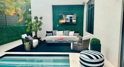 a living room with a couch and a pool at Luxury Gem in Fort Lauderdale