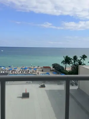 a view of the ocean from the balcony of a condo at Direct Ocean View Condo,Balcony kitchen pool gym sauna valet parking direct beach access for perfect vacation in Sunny Isles Miami in Sunny Isles Beach