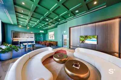 a large living room with a couch and a table at Cozy Ensuite 1BR Apartment in DTW Miami in Miami