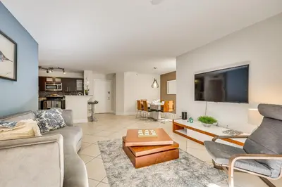 a living room with a couch and a table at Resort Condo By Aventura Mall! Gated Community in Aventura