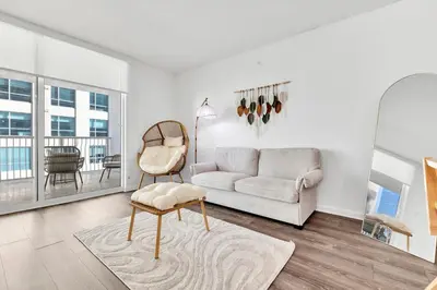 a living room with a couch and a chair at Upscale4 Brickell Retreat with Bay n City Views in Miami