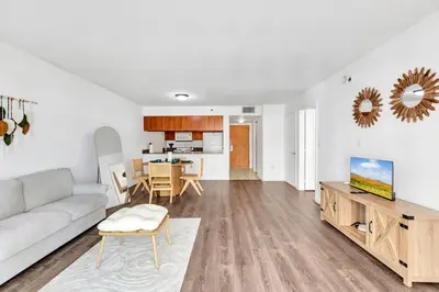 a living room with a couch and a table at Upscale4 Brickell Retreat with Bay n City Views in Miami